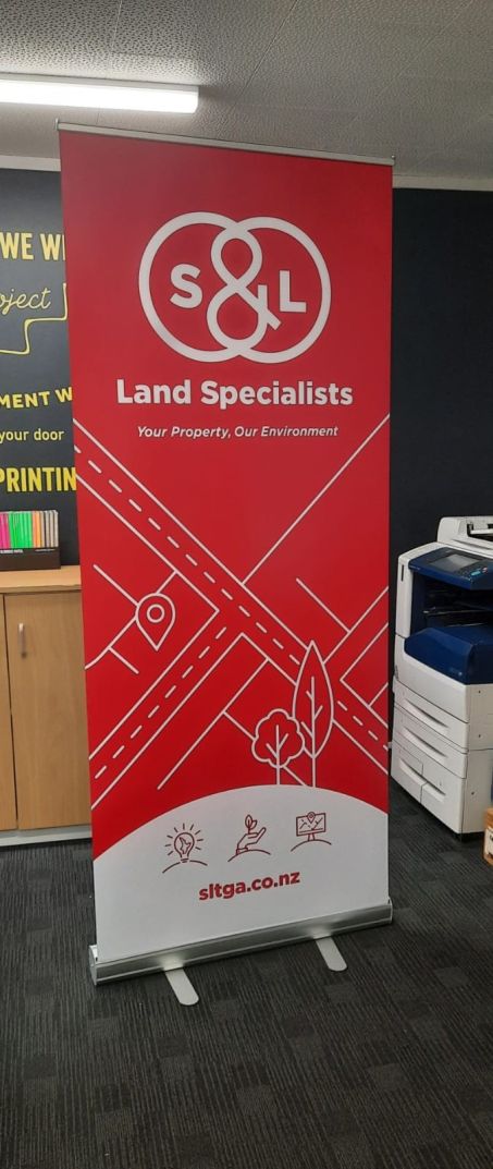 S&L Land Specialists Pull Up Banner